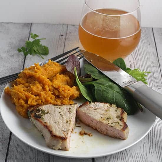 Easy Cilantro Lime Pork Chops paired with a crisp, refreshing beer.