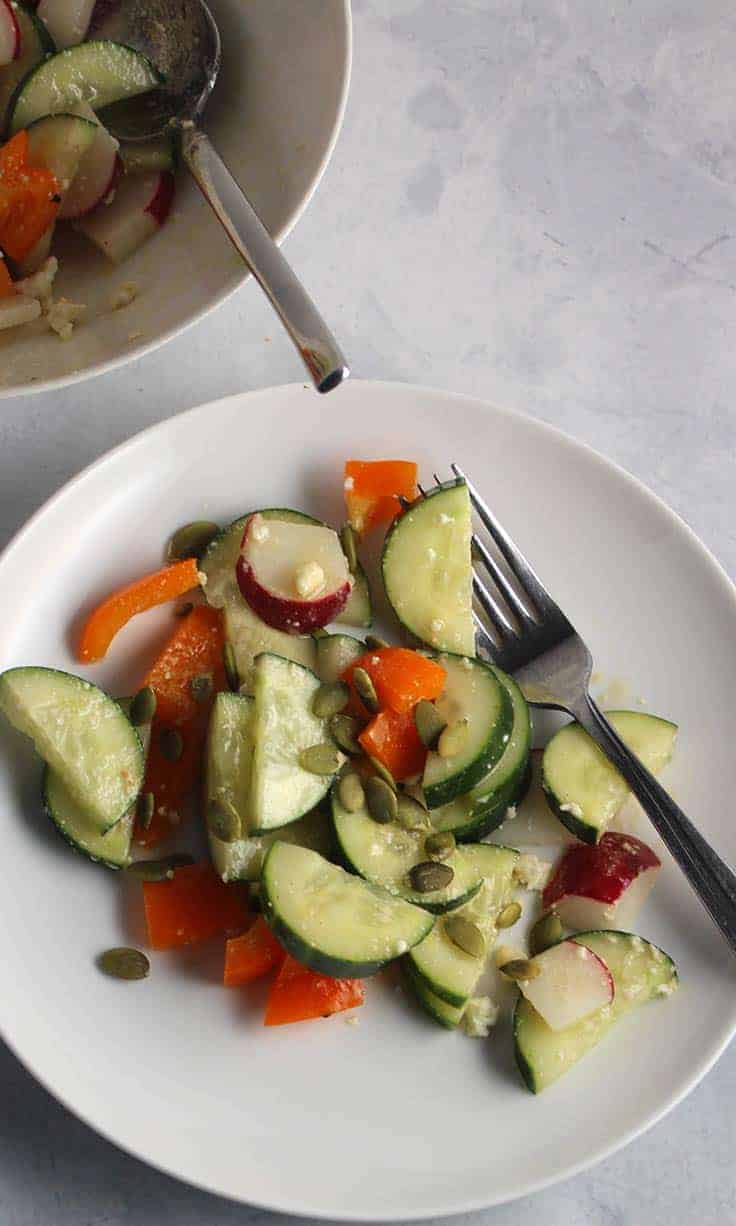 cucumber radish salad tossed with an easy maple vinaigrette recipe for a tasty side dish with a healthy crunch.