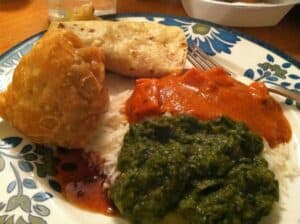 Chicken Tikka Masal and Aloo Palak, paired with a Muscat