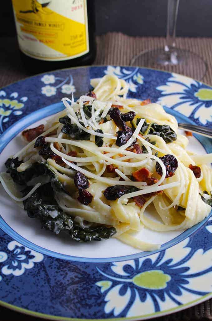 Festive Fall Fettuccine combines a creative turnip cream with healthy greens, topped with bacon and cranberries for a tasty fall meal. | cookingchatfood.com