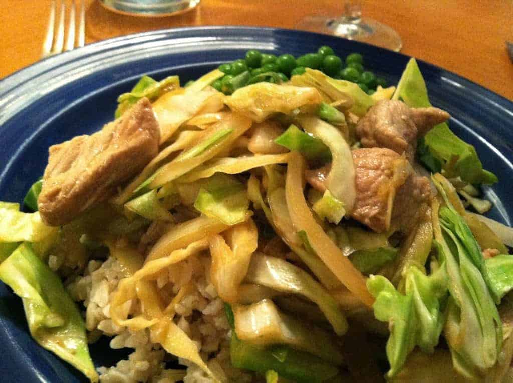 pork and cabbage served over brown rice