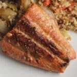 pan seared salmon plated with quinoa.