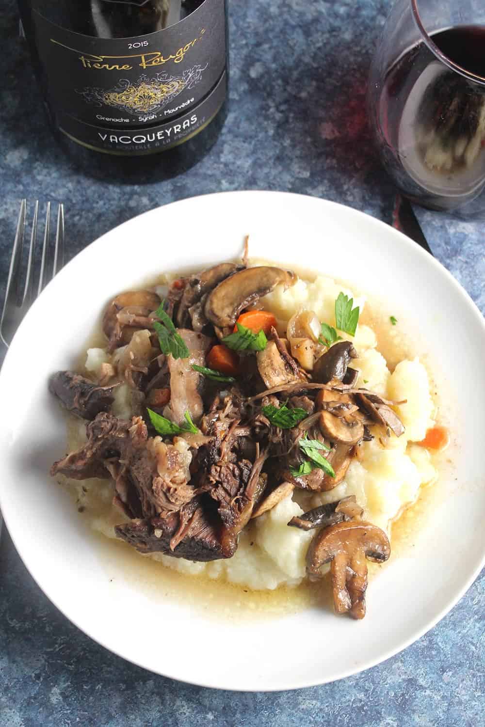 red wine braised short ribs served over mashed potatoes