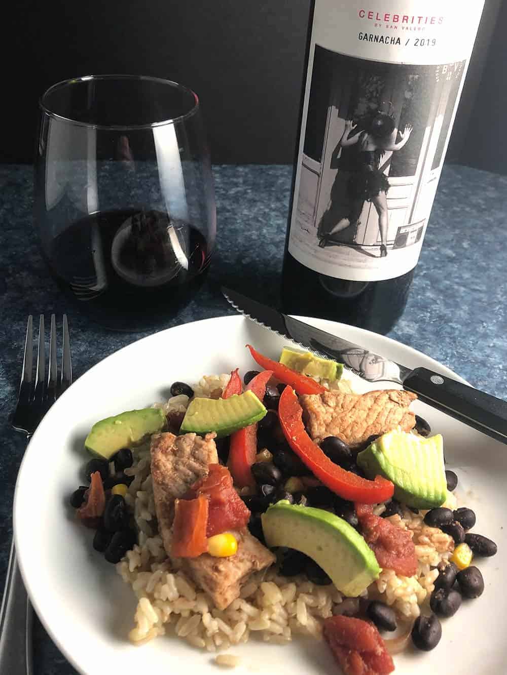 pork and black beans served with red wine.