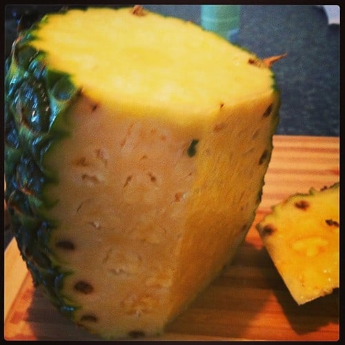Coring a pineapple for grilled swordfish with pineapple salsa.