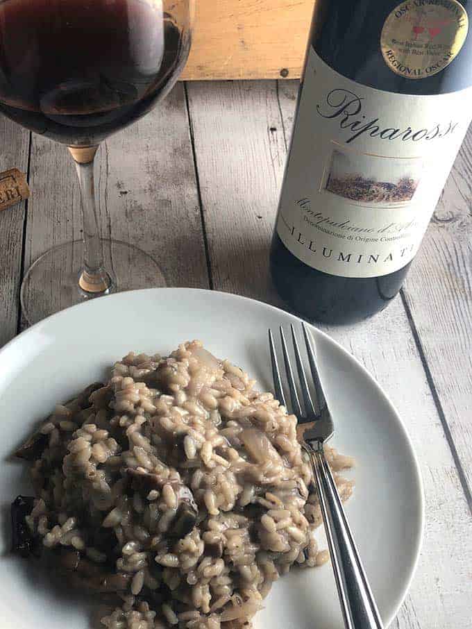 Mushroom risotto on a plate with Riparasso Montepulciano d'Abruzzo.