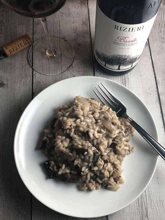 plate of mushroom risotto with a Barolo wine.