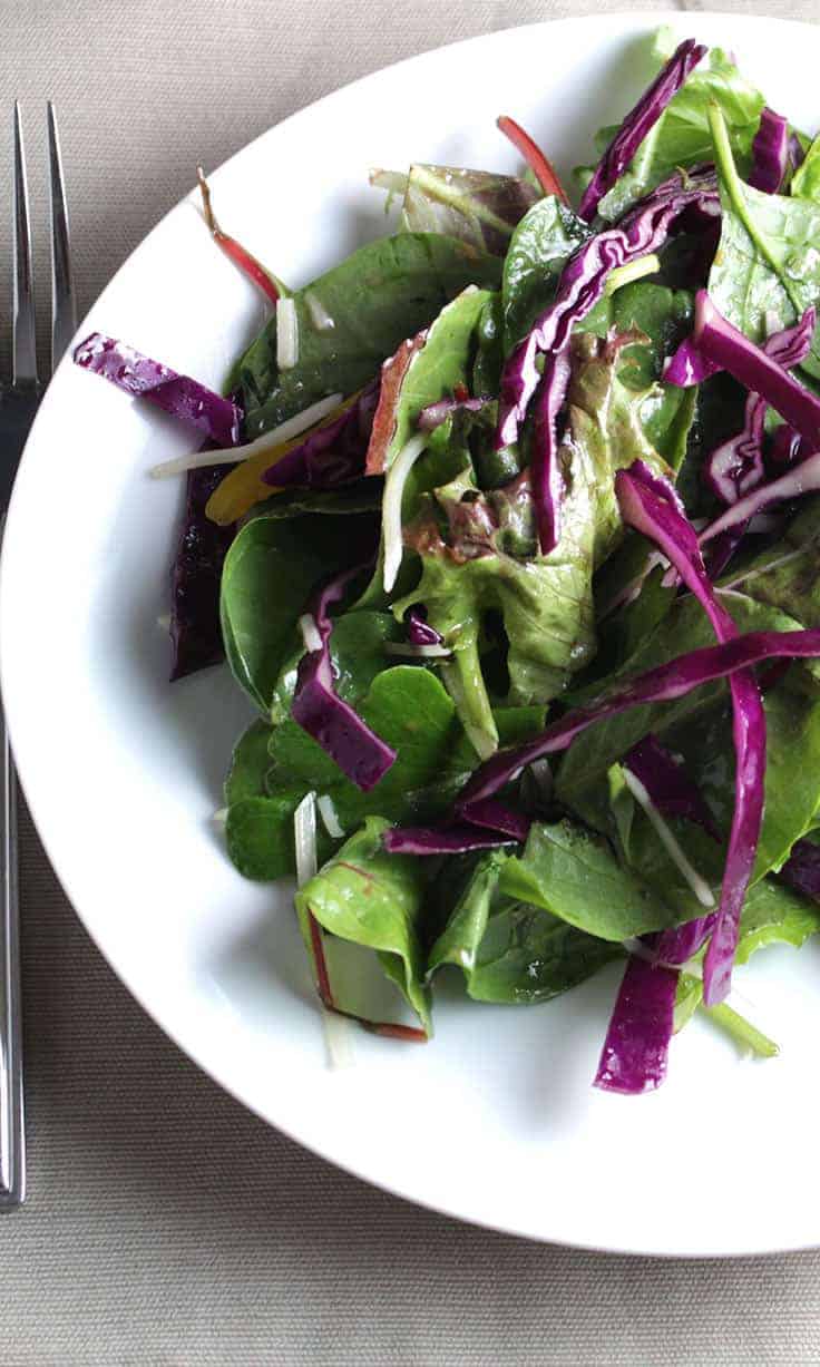 Greens and Cabbage Salad tossed with a tasty smoky maple dressing with just the right touch of sweetness. | cookingchatfood.com