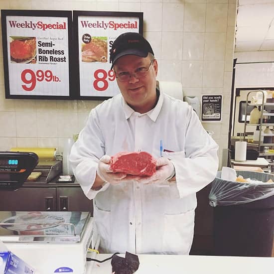 picking out a roast with the help of a Roche Bros. butcher