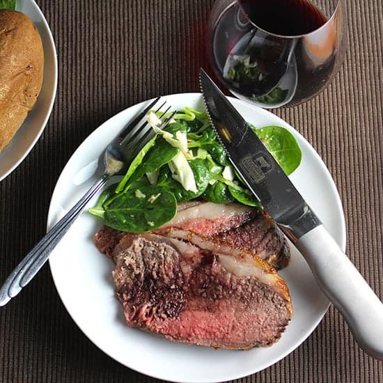 strip roast beef recipe topped with a simple red wine sauce.