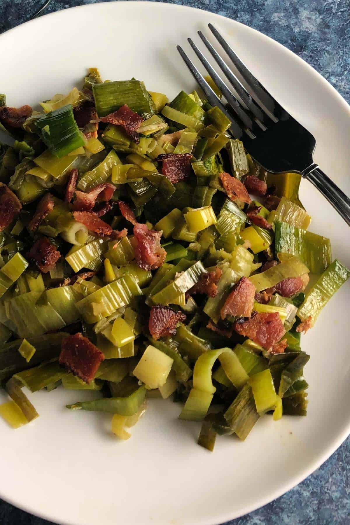 plate with sautéed leek greens