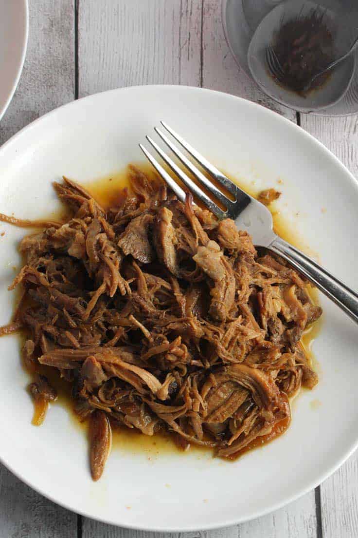 Dig into some savory slow cooker pulled pork for dinner! A little prep following this easy recipe, then let the slow cooker do the work.