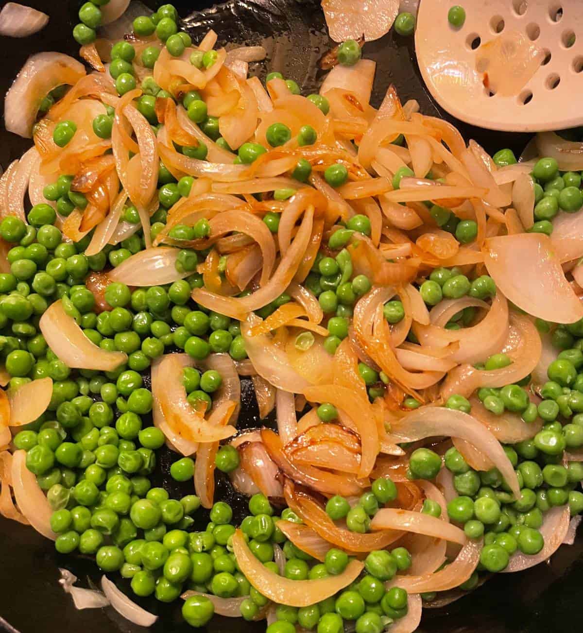 peas and onions in a skillet.