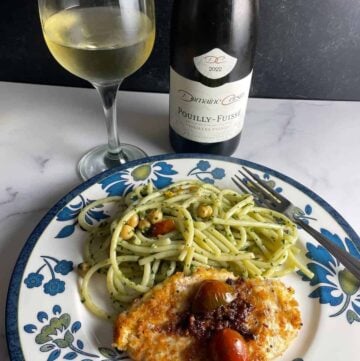 Bottle of Pouilly-Fuissé served with pasta and Chicken Romano.