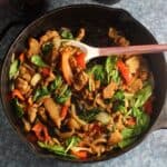 seitan with peppers and onions in a skillet