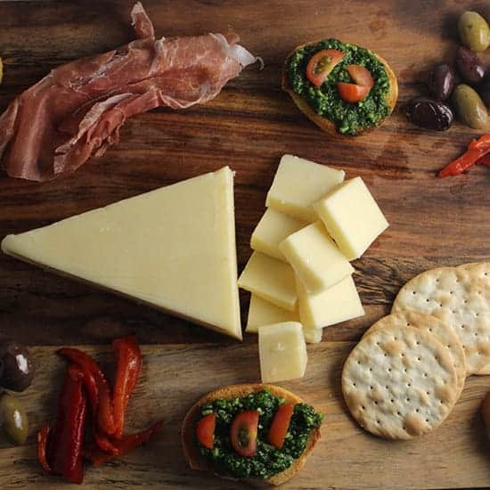 Easy Holiday Cheese Board with Kale Pesto Crostini