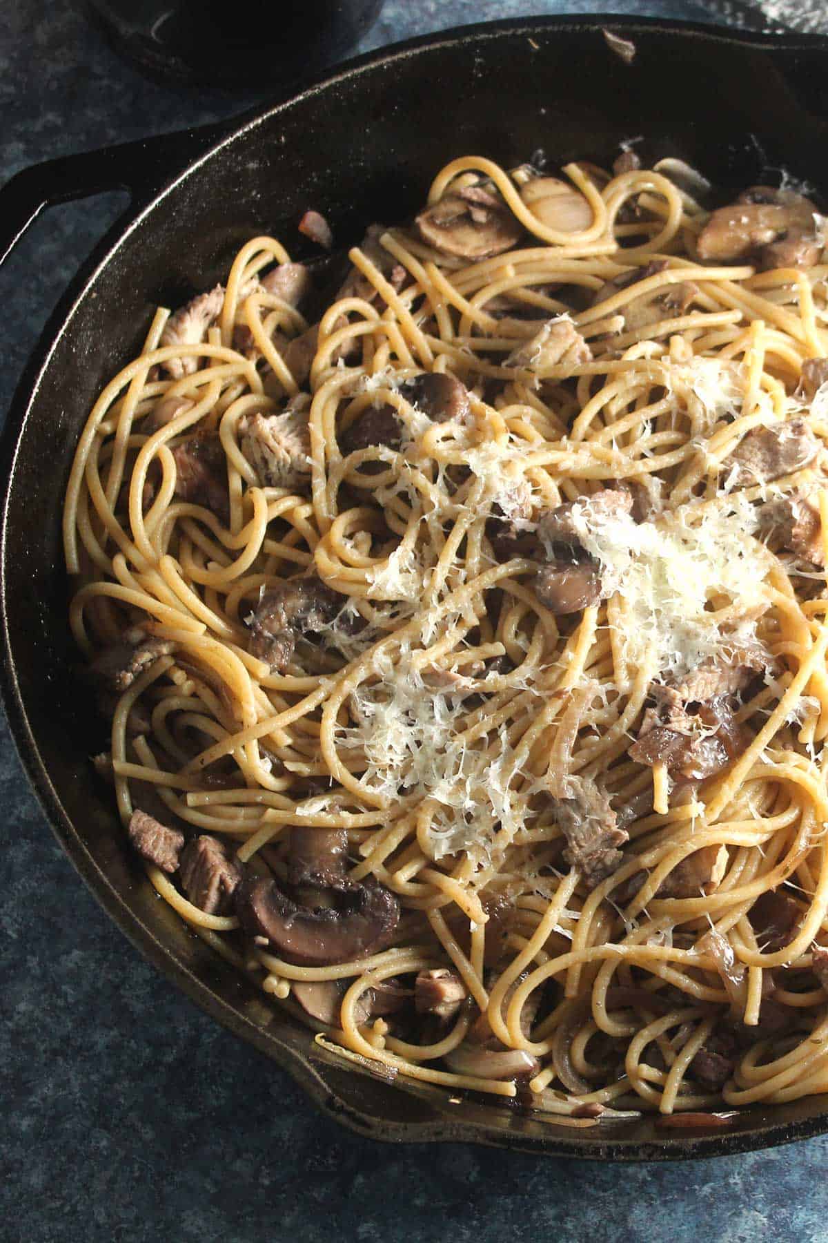 leftover turkey pasta tossed in a skillet.