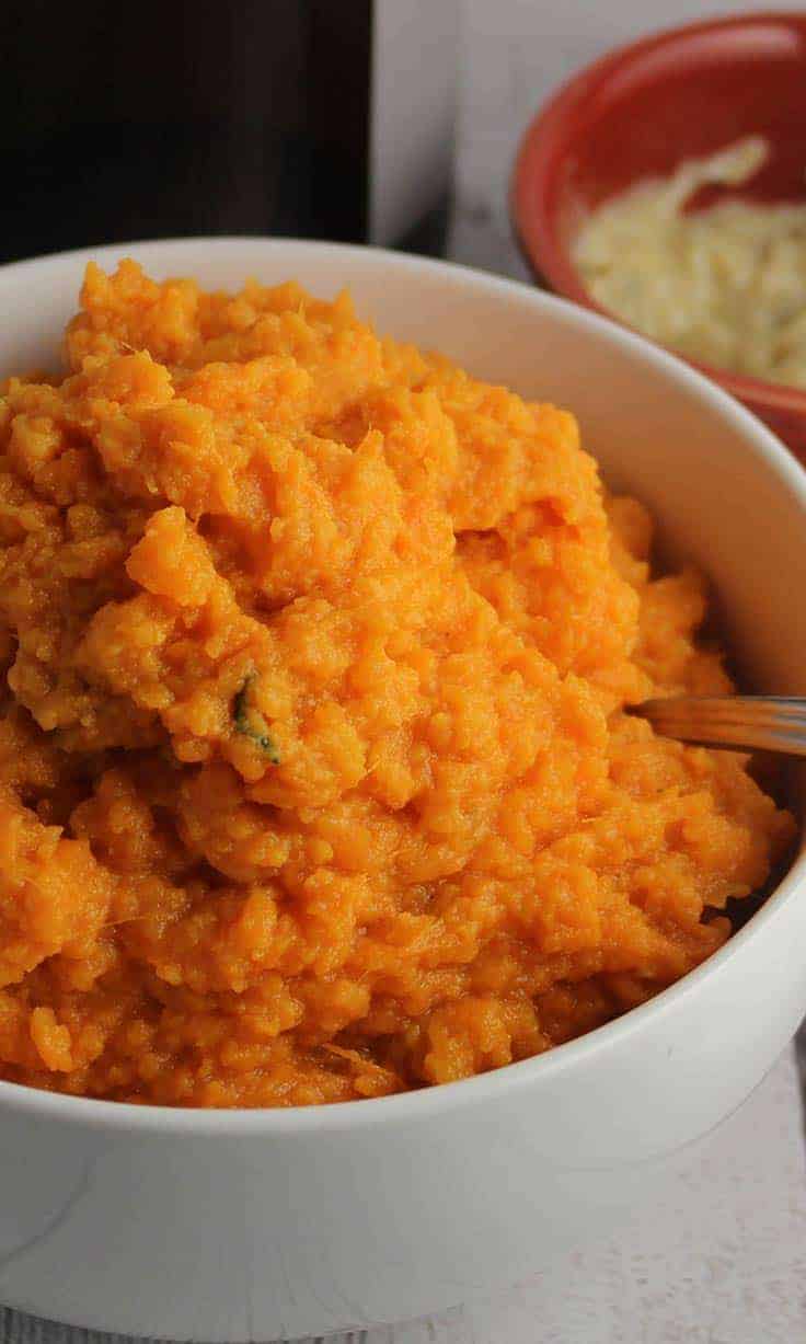 Mashed Sweet Potatoes with Cumin Sage Butter in a bowl.