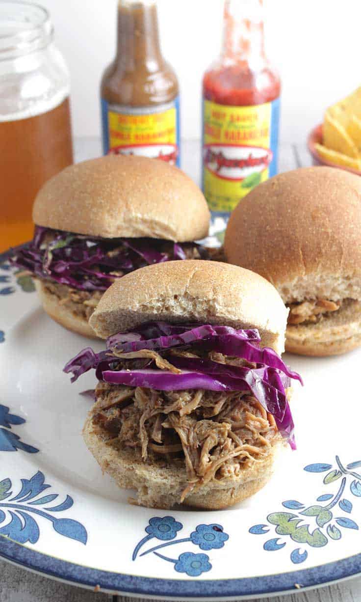 Spicy Pulled Pork Slides recipe featuring El Yucateco® hot sauce. Perfect for homegating for a big game!