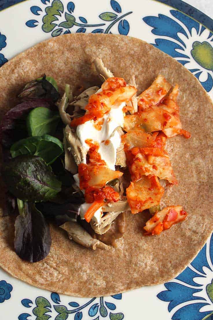 Kimchi gives a spicy crunch to this easy chicken burrito recipe.