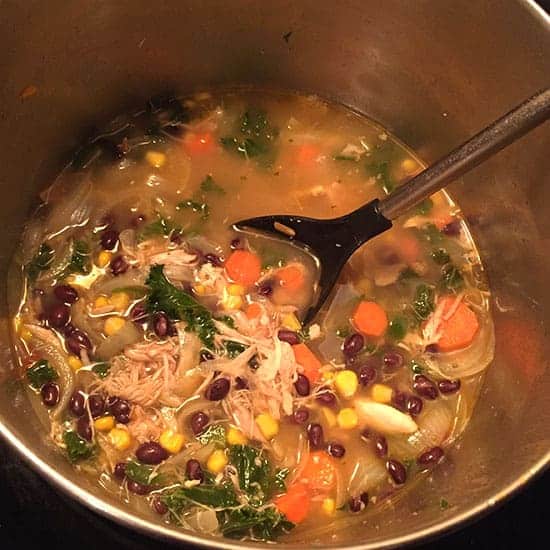 making chipotle chicken and black bean soup