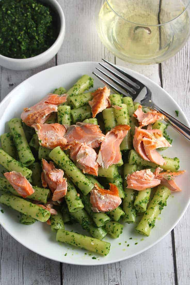 ziti tossed with kale pesto and salmon for a healthy, tasty pasta recipe.