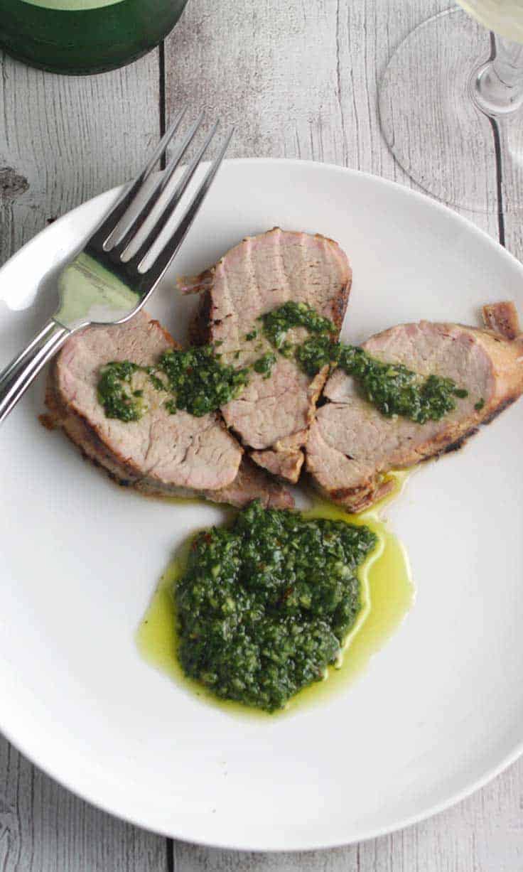 Grilled pork tenderloin recipe with bright, flavorful cilantro pesto. #SundaySupper