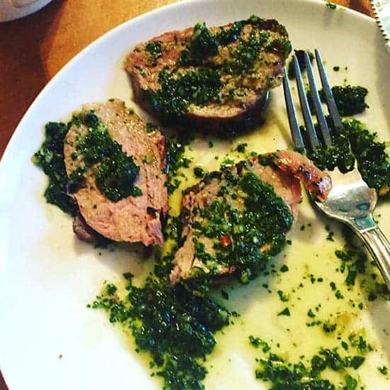 enjoying pork tenderloin with cilantro pesto