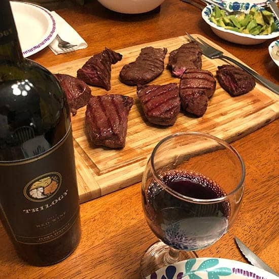 trilogy wine paired with grilled steak.