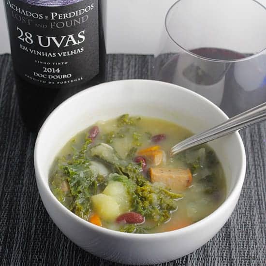 bowl of Portuguese kale soup served with a red wine from Portugal. 
