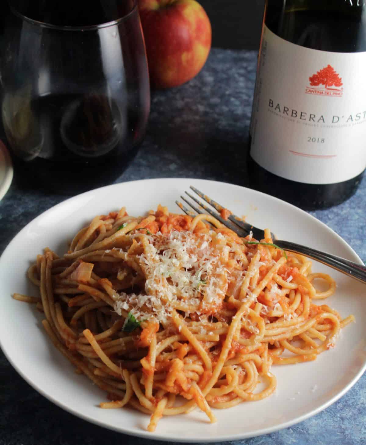 spaghetti with apple tomato sauce served with a Barbera, Italian red wine.