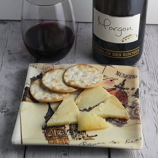 Morgon red wine pairs well with Tomme de Savoie cheese.