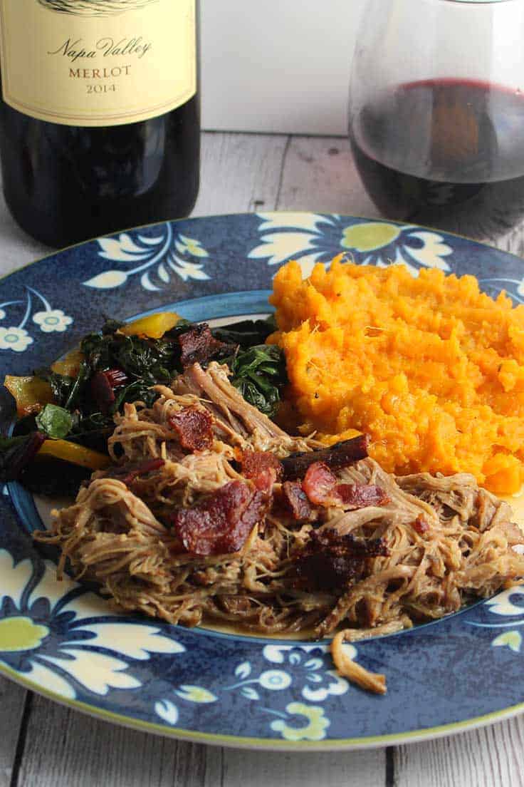 pulled pork with bacon, served with sweet potatoes, greens and a good glass of Merlot. #slowcooker #pulledpork #bacon #Merlot