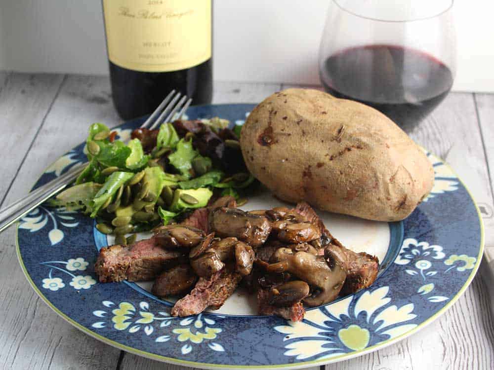 ribeye with mushrooms and a Duckhorn Merlot.