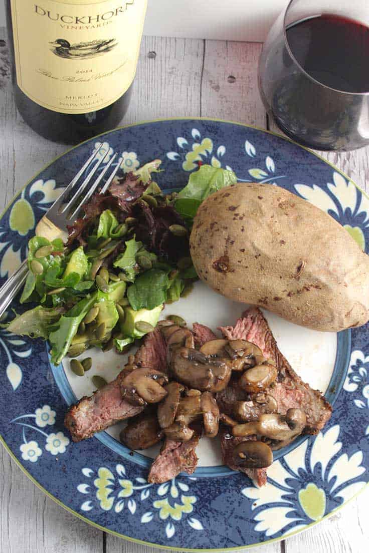 Ribeye steak with mushrooms, paired with a special Merlot wine. #wine #steak 