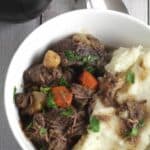 Beef Stew with Root Vegetables features fall apart tender meat and a succulent sauce, served with mashed potatoes for some serious comfort food.