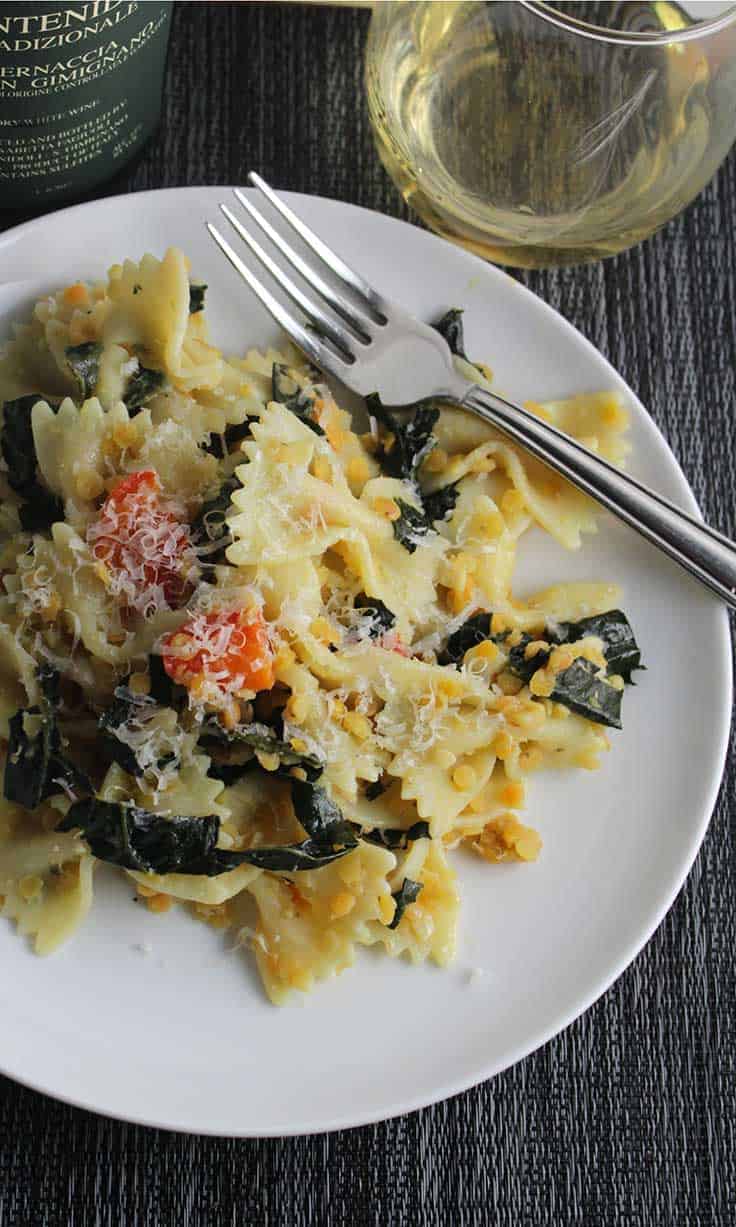 Tuscan Kale Pasta on a plate served with white wine
