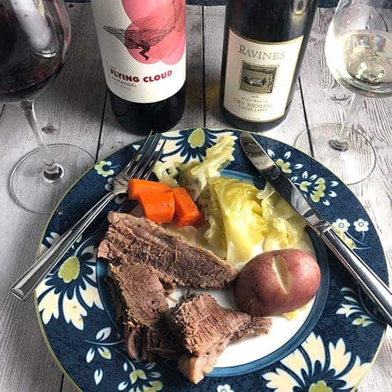 corned beef on a plate served with wine.