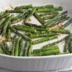 Roasted Asparagus with Parmesan in a white baking dish.