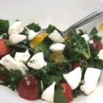 kale caprese salad in a bowl