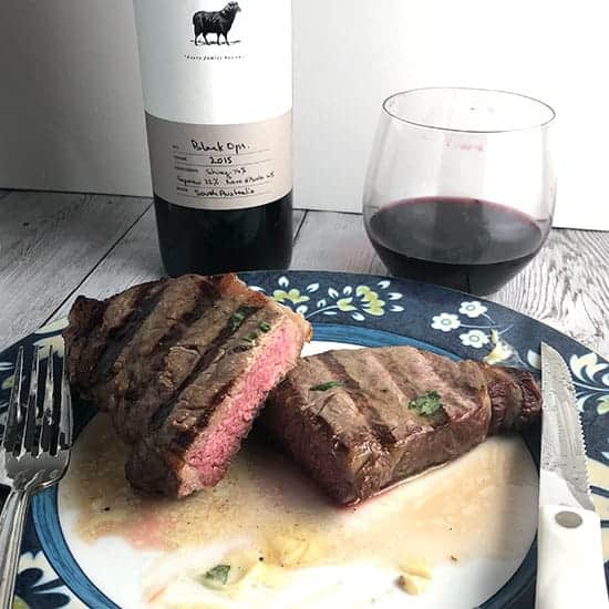grilled steak with garlic butter and Hugh Hamilton Black Ops wine.