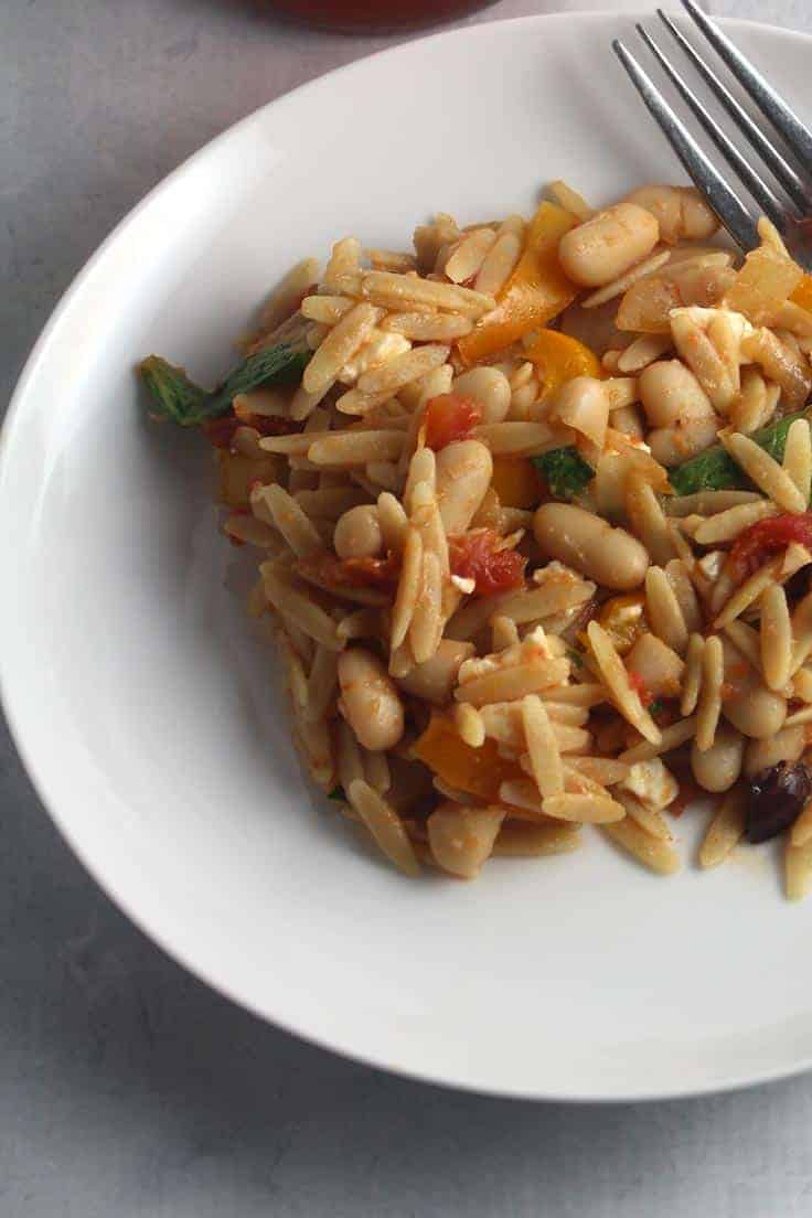 Orzo with spinach, white beans and other veggies is a delicious side dish or vegetarian main. #orzo #sidedish