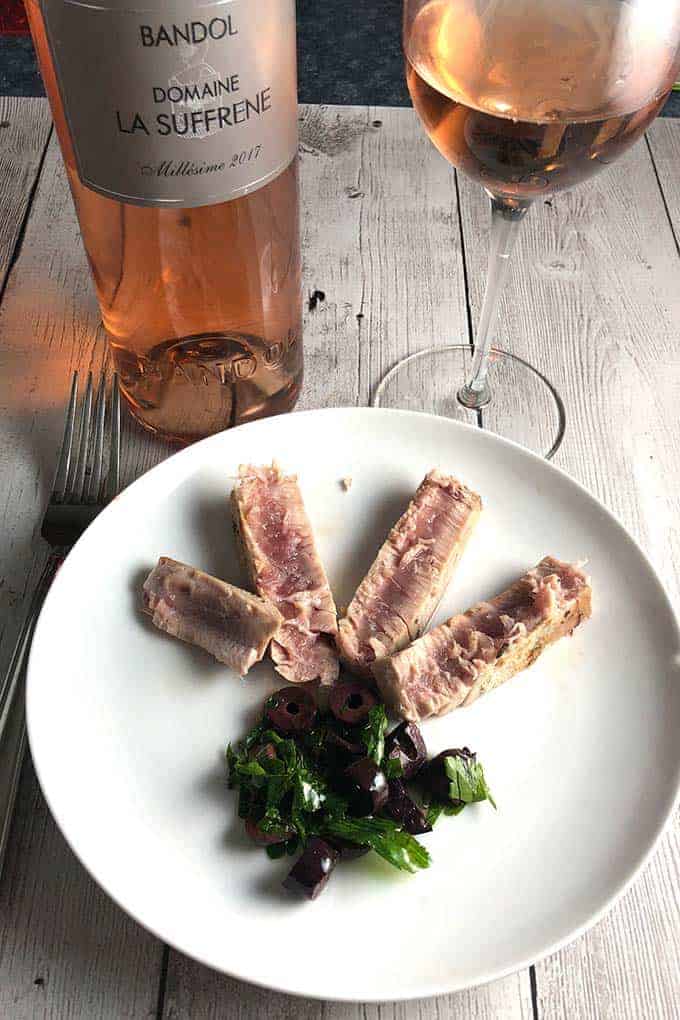 pan seared plated with olive relish, served with a rosé wine.