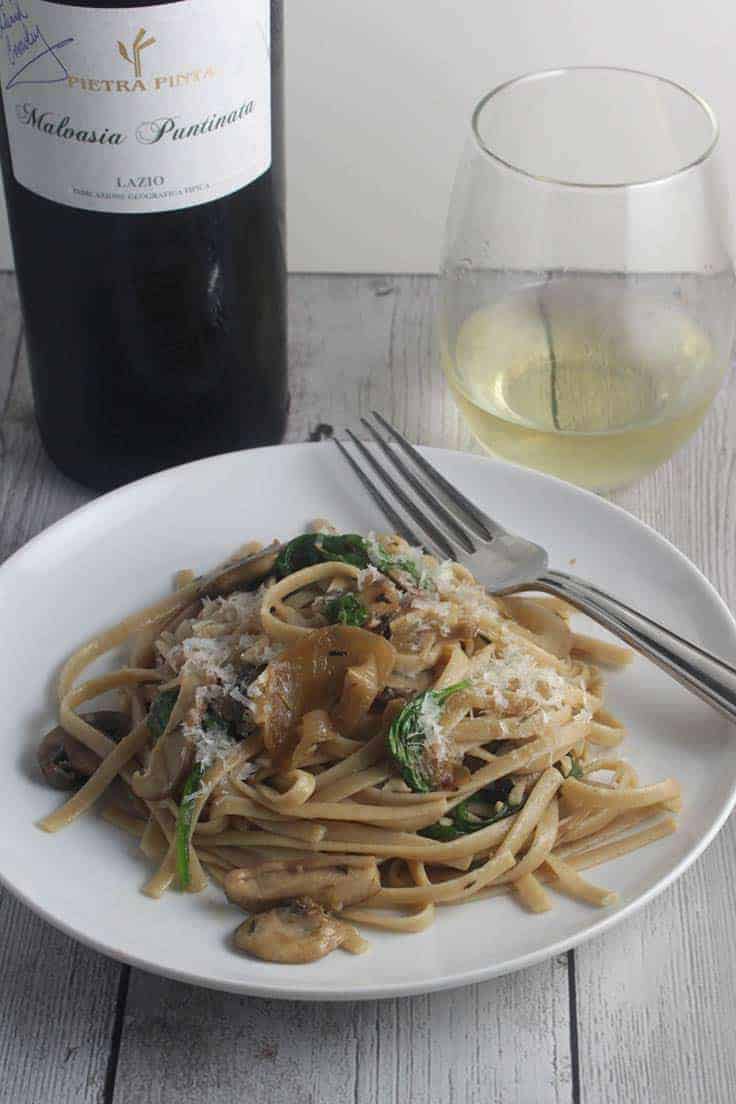 Spinach and Mushroom Pasta, with a bit of prosciutto, is delicious paired with Malvasia Puntinata, a white wine from the Lazio region of Italy. #pasta #winepairing #Italianfood