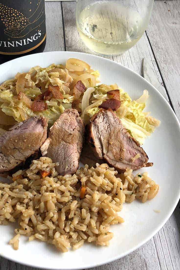 Cider Marinated Pork Tenderloin with Cabbage plus a bit of bacon is a delicious fall recipe. Great paired with a German Riesling. #pork #fallrecipes #winepairing