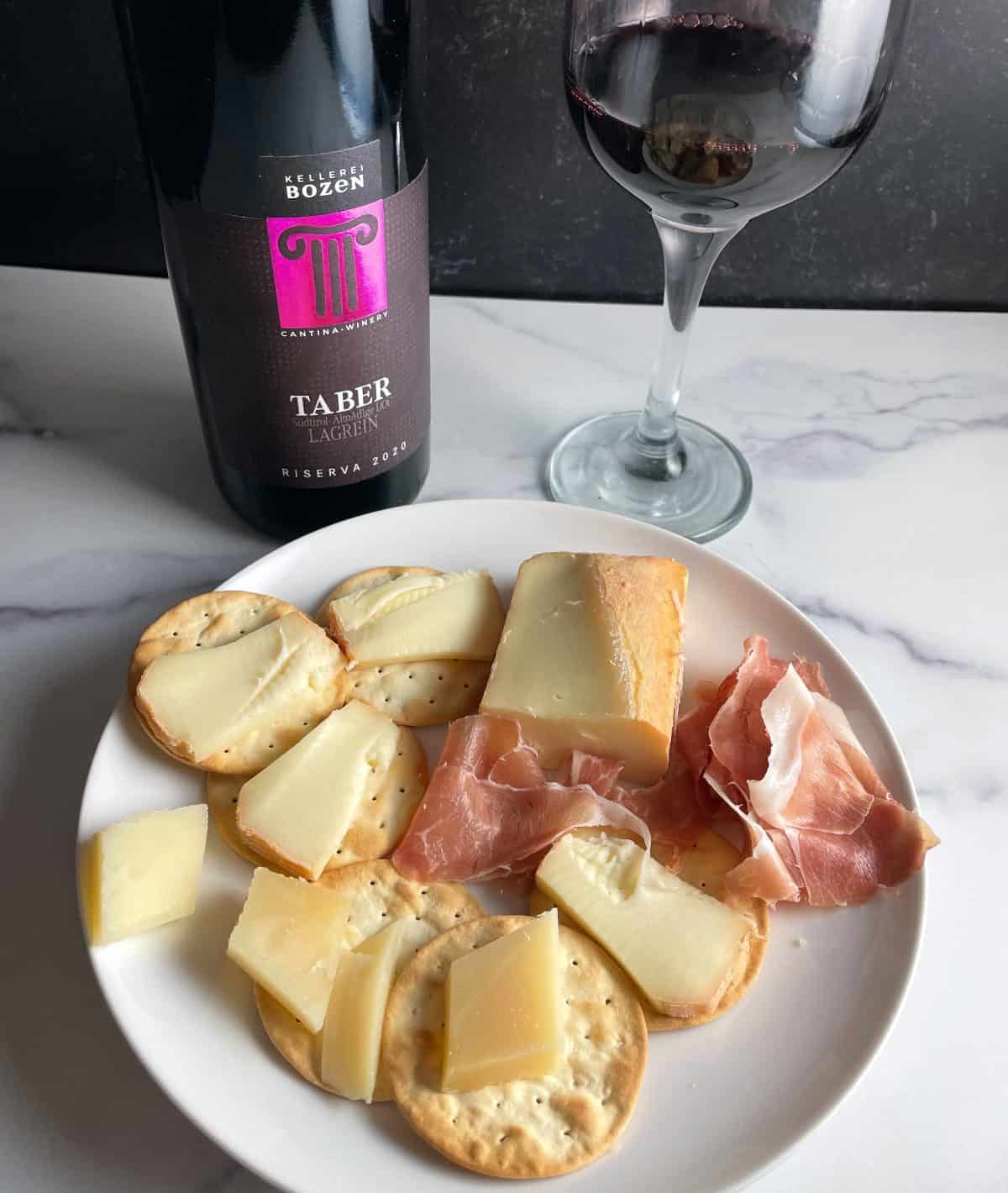 Taber Lagrein wine served with a cheese plate.
