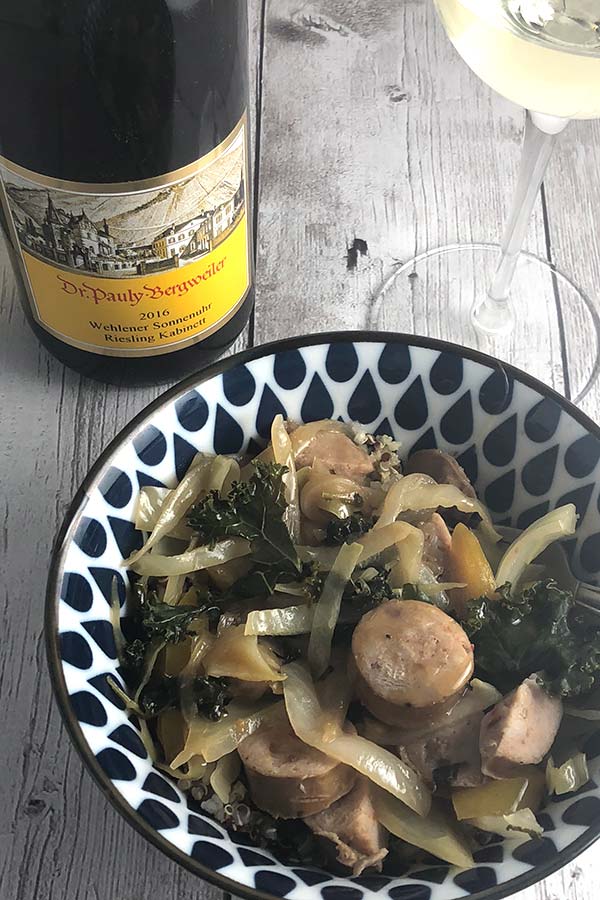 chicken sausage veggie bowl served with white wine.