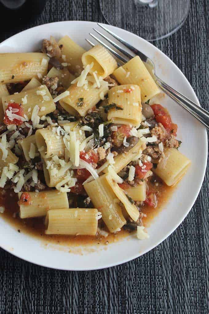turkey, mushrooms, and grass fed beef simmer for a hearty yet healthier Bolognese sauce. delicious with a good glass of Italian red wine. #pasta #healthyrecipes #Bolognese #winepairing