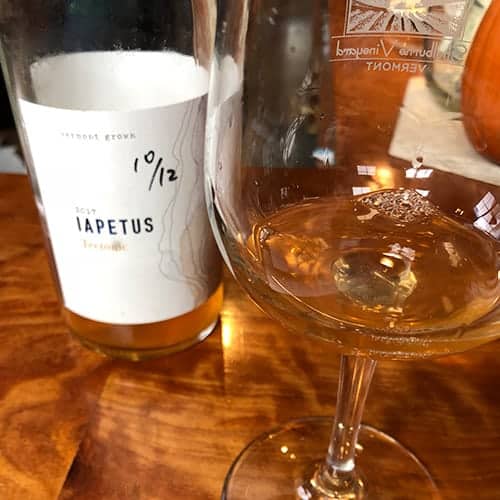 bottle and glass of Iapetus Tectonic wine.