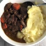 beef daube served with mashed potatoes in a bowl.